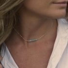 girl wearing a silver chain necklace with amazonite beads