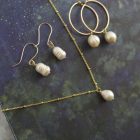 pearl necklace with a gold satellite chain, pearl dangle earrings, pearls on gold hoops