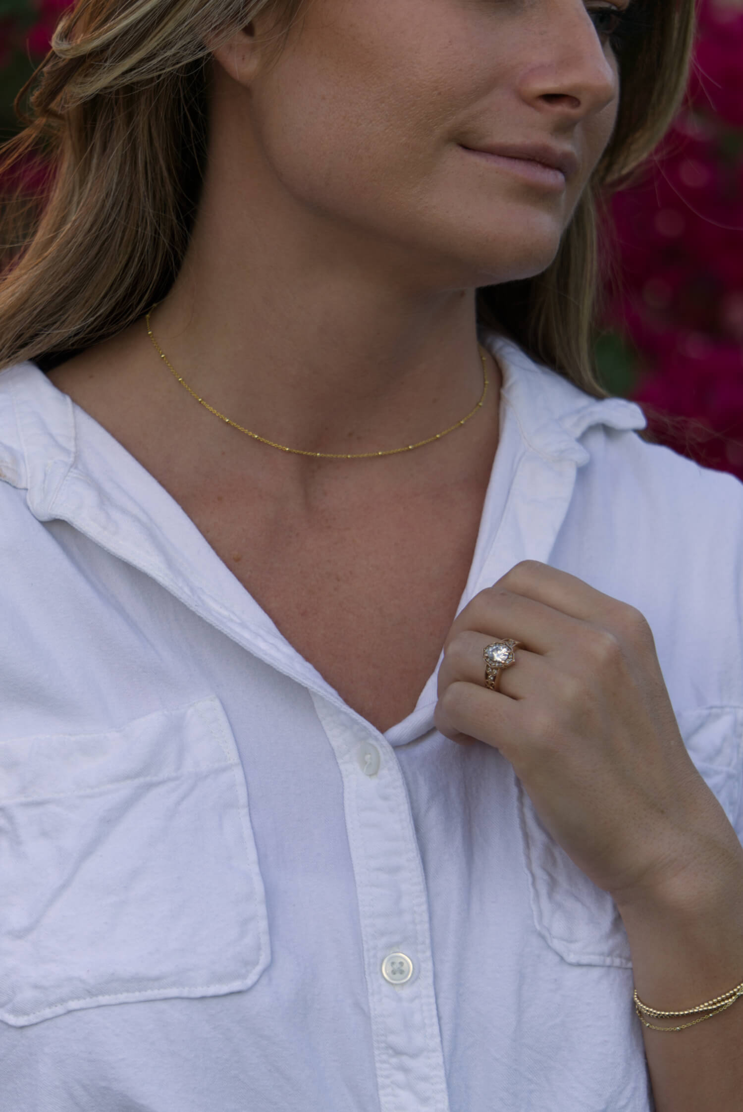 gold beaded chain necklace worn by girl